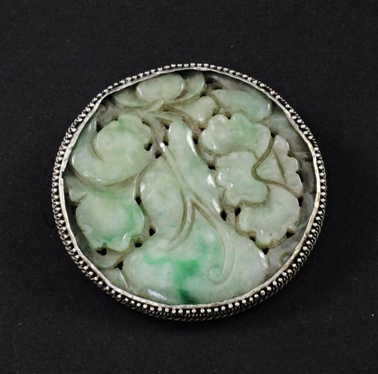 A Chinese jadeite circular plaque, 19th century, 5cm diam.